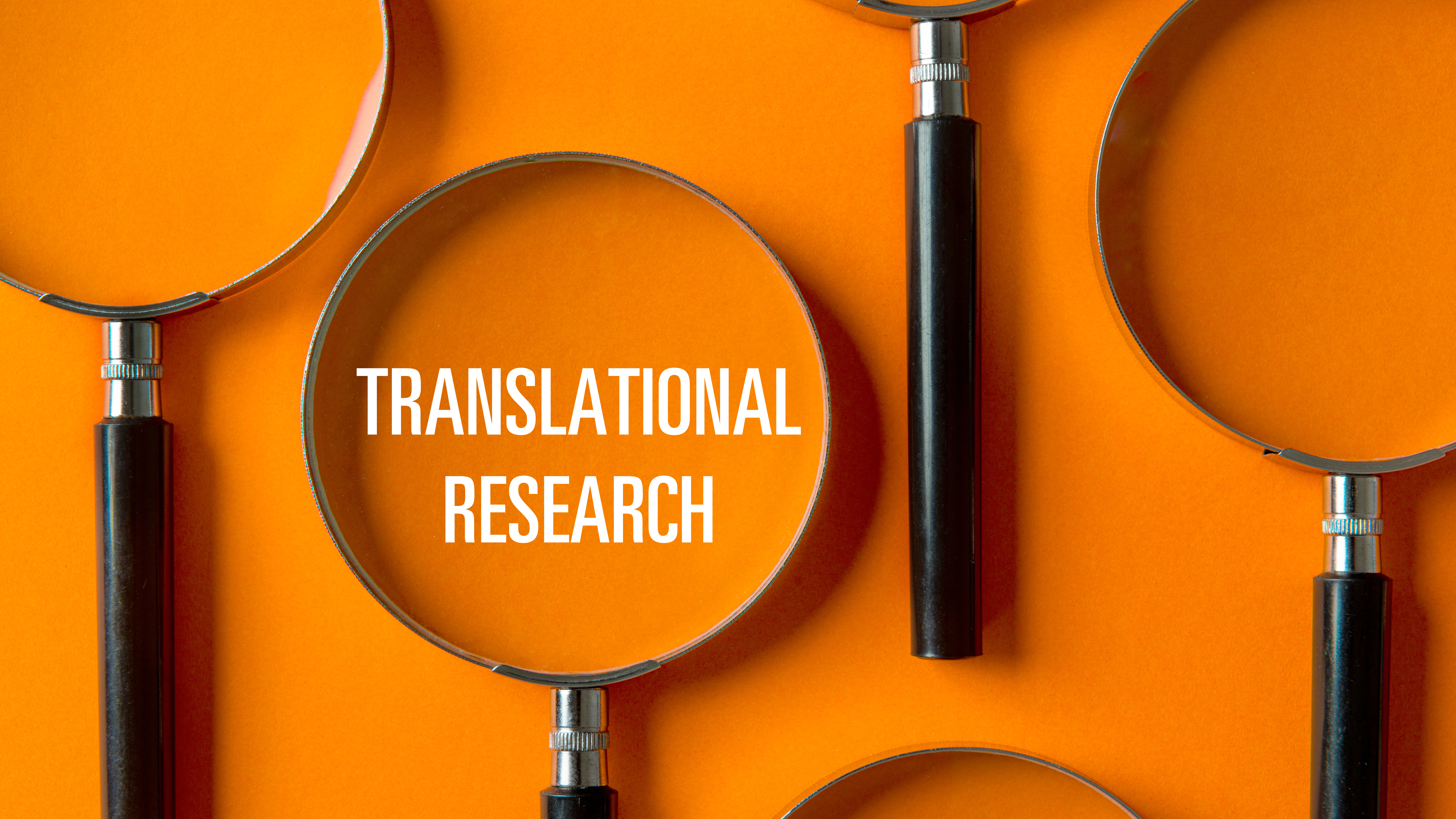 Translational research graphic of a group of magnifying glasses on an orange background